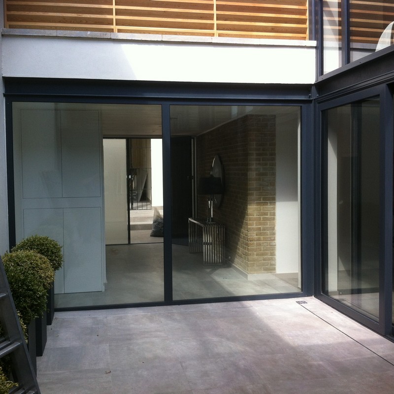 Floor-to-ceiling sliding doors opening to courtyard in Bellingham