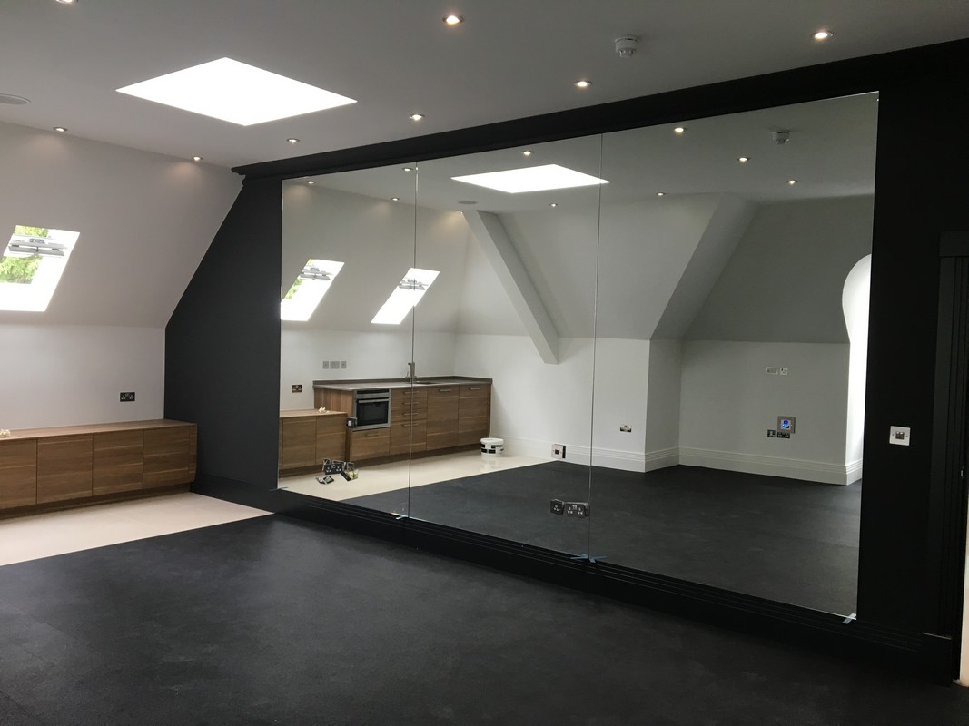 Frameless glass wall dividing loft conversion in Bellingham